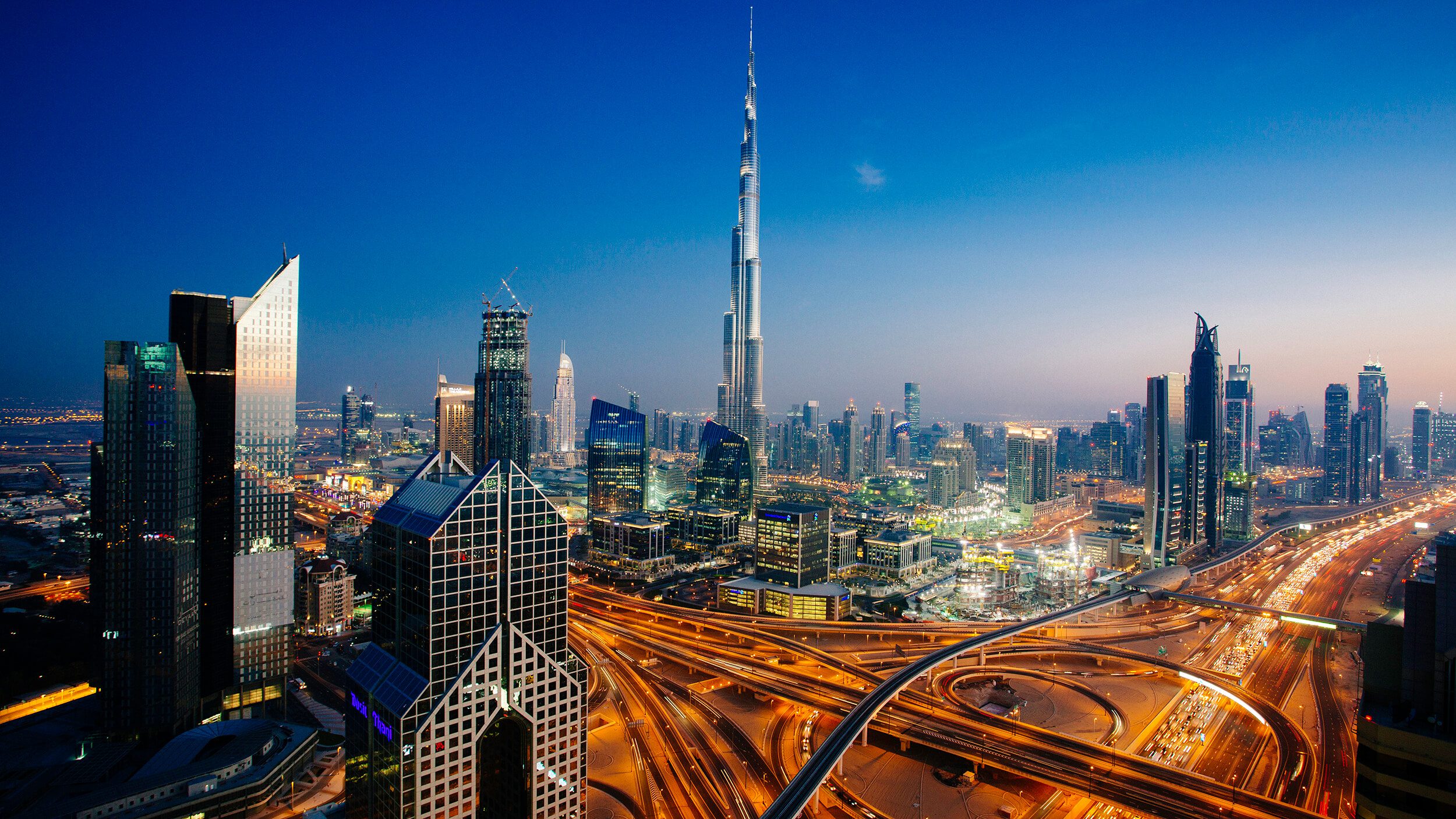 Dubai sky line with traffic junction and Burj Khalifa - Cendyn